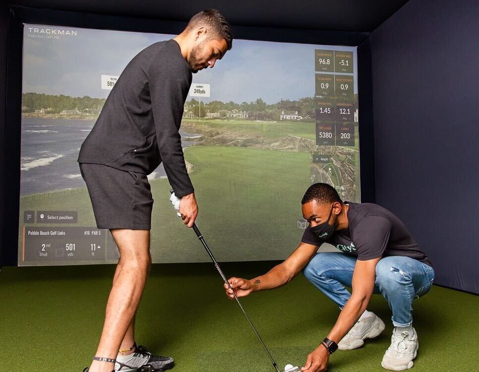 PGA Coach Demarkis Cooper teaching a student